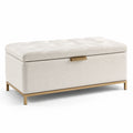 Panca contenitore in tessuto di lino beige con struttura in metallo dorato